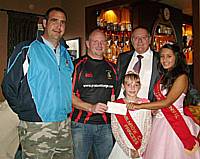 Receiving £500 from Milnrow Carnival Chairman Paul Kettle and the Carnival Queens